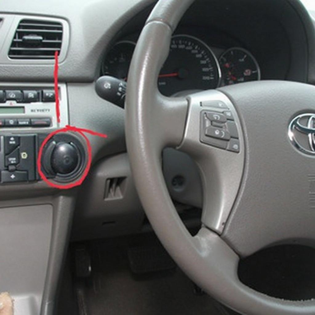 2004 Toyota Camry OBD2 port location under the dashboard near the steering column