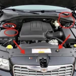 2006 Chrysler 300C 5.7L engine bay with highlighted ECM and TCM locations