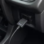 Bluetooth OBD2 Adapter Connected to Car's OBD2 Port