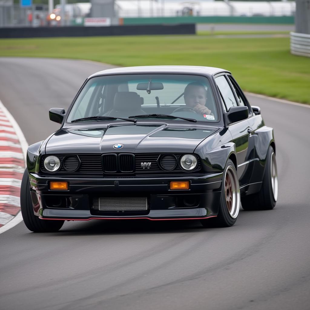 BMW M3 racing car speeding on a racetrack