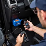 Mechanic using a Ford F250 OBD2 reader