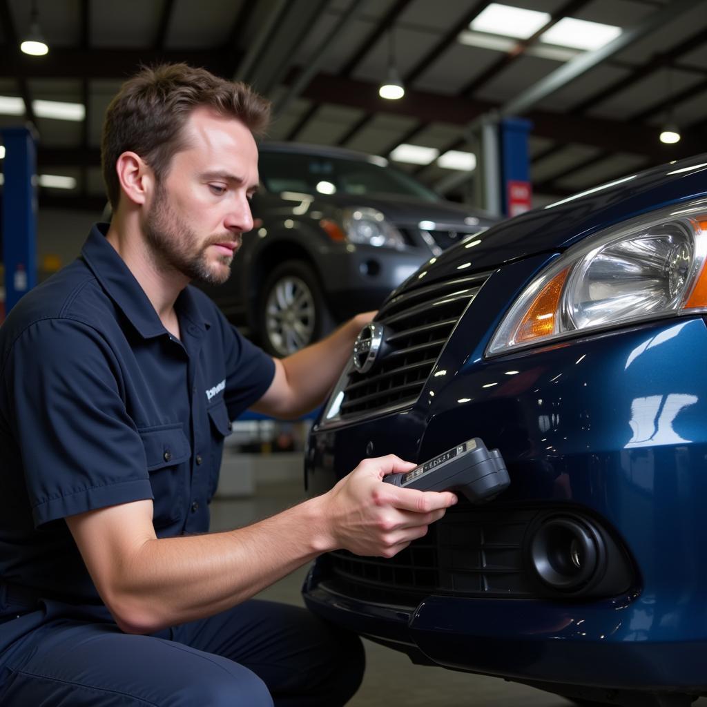 Mechanic Diagnosing Nissan Sentra with OBD2 Scanner