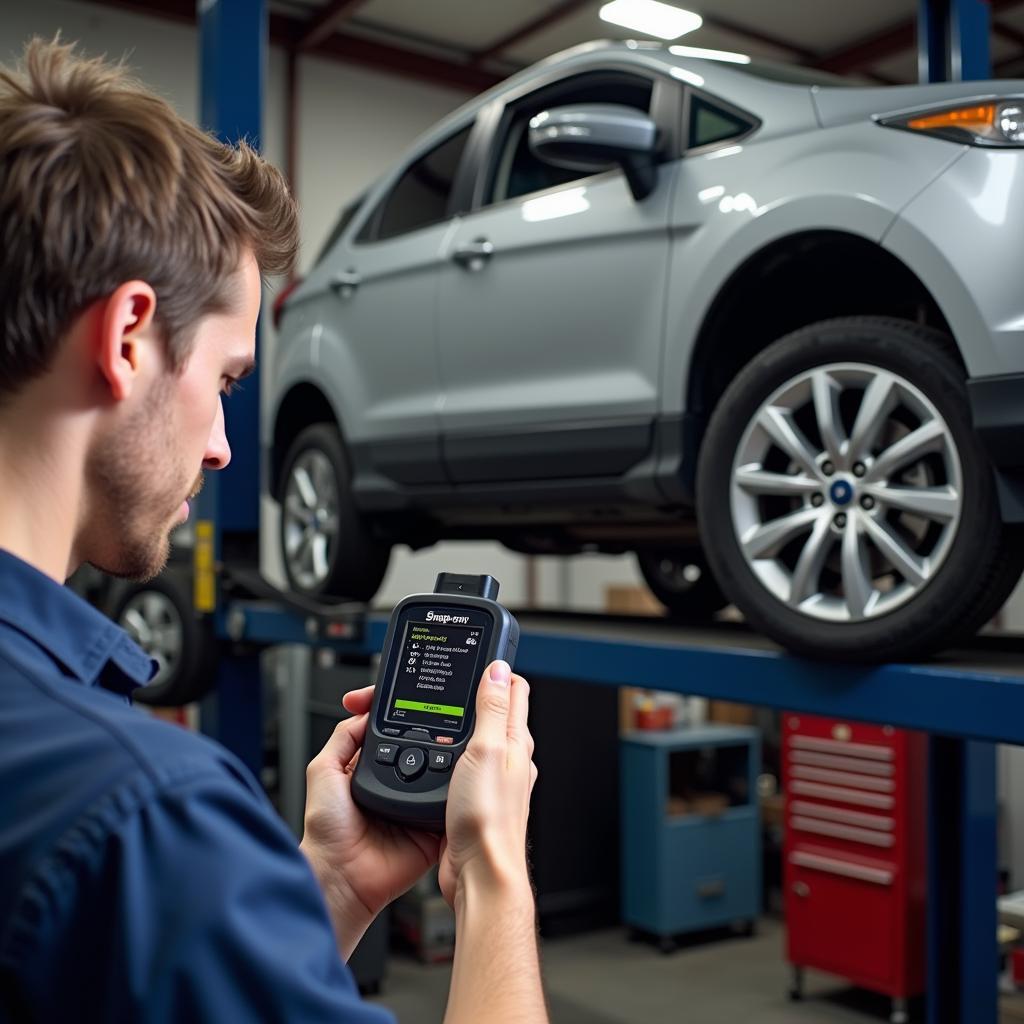 Mechanic Using a Snap-on OBD2 Scanner