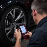 Mechanic Diagnosing TPMS Issue