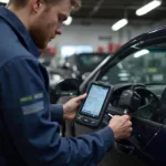 Mechanic using an OBD2 scanner to diagnose a car problem.