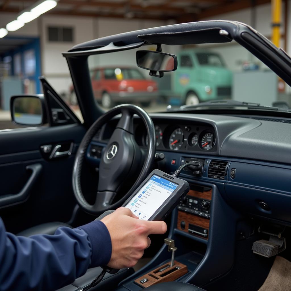 Mechanic Diagnosing W124 with OBD2 Scanner