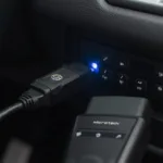 Microtech OBD2 Bluetooth Scanner connected to a car's OBD2 port