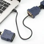 OBD2 RS232 adapter cable connecting car and laptop