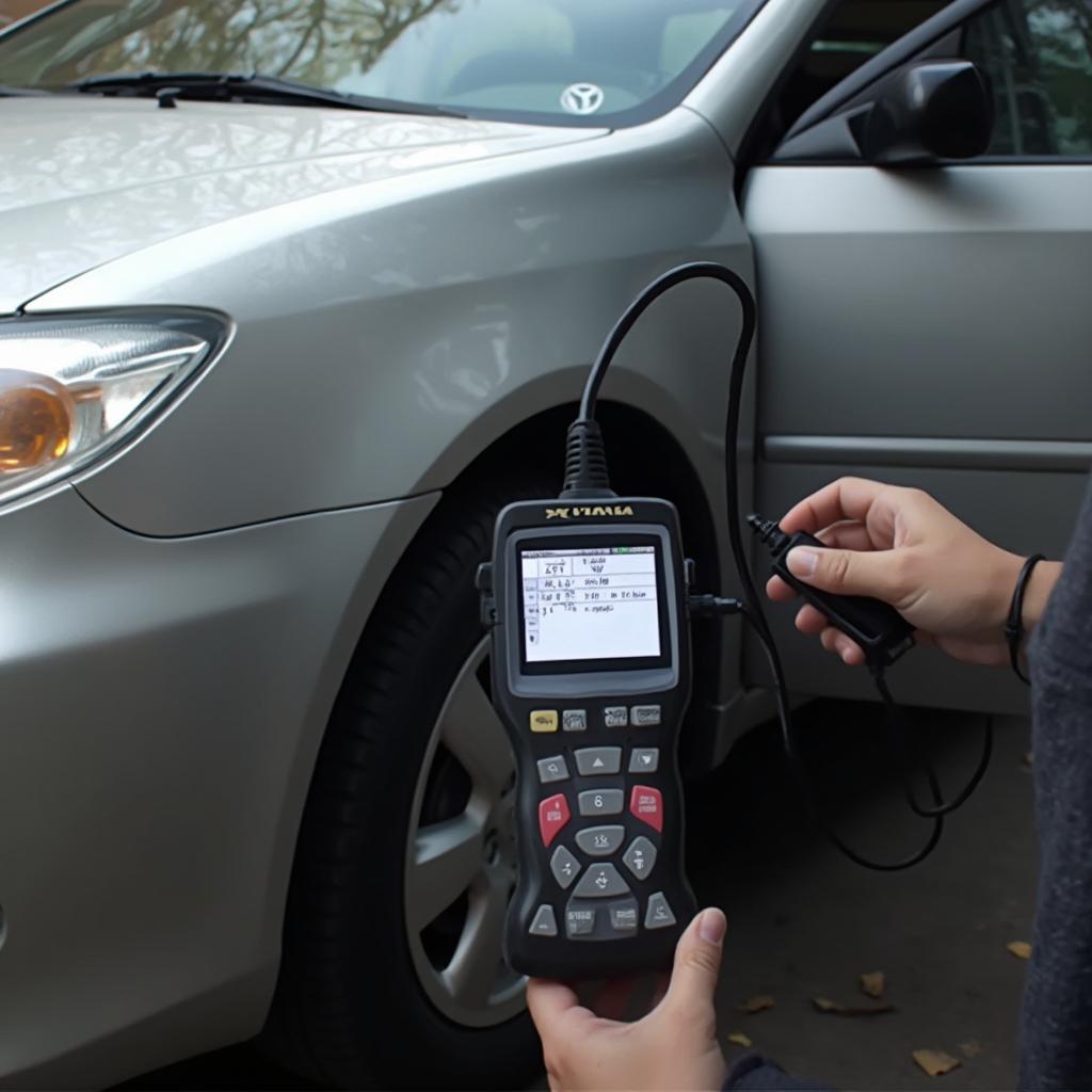 OBD2 scanner connected to a 2004 Toyota Camry for diagnostics