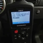 OBD2 scanner displaying P0449 code on screen