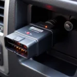 Panlong Bluetooth OBD2 Scanner connected to a car's OBD2 port