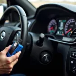 Mechanic connecting a device to the OBD2 port of a car