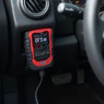 Carcode OBD2 Scanner Plugged into Port