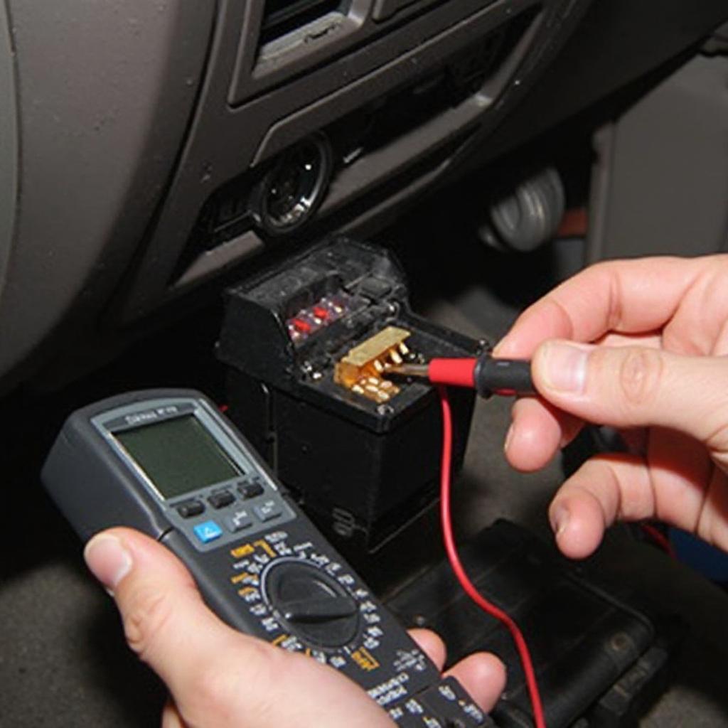 Technician Checking the OBD2 Port Fuse in a 2004 Ford F150