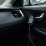 Chip Tuning OBD2 Interface Connected to Car