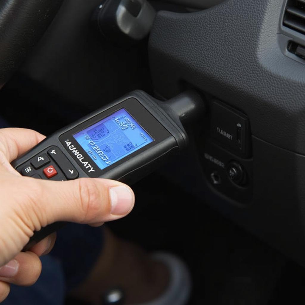 A hand holding an OBD2 scanner connected to a car's diagnostic port, demonstrating the process of accessing vehicle data.