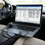 Honda OBD2 scanner software displayed on a laptop, connected to a car's OBD2 port.