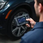 Mechanic using an OBD2 ABS Scanner