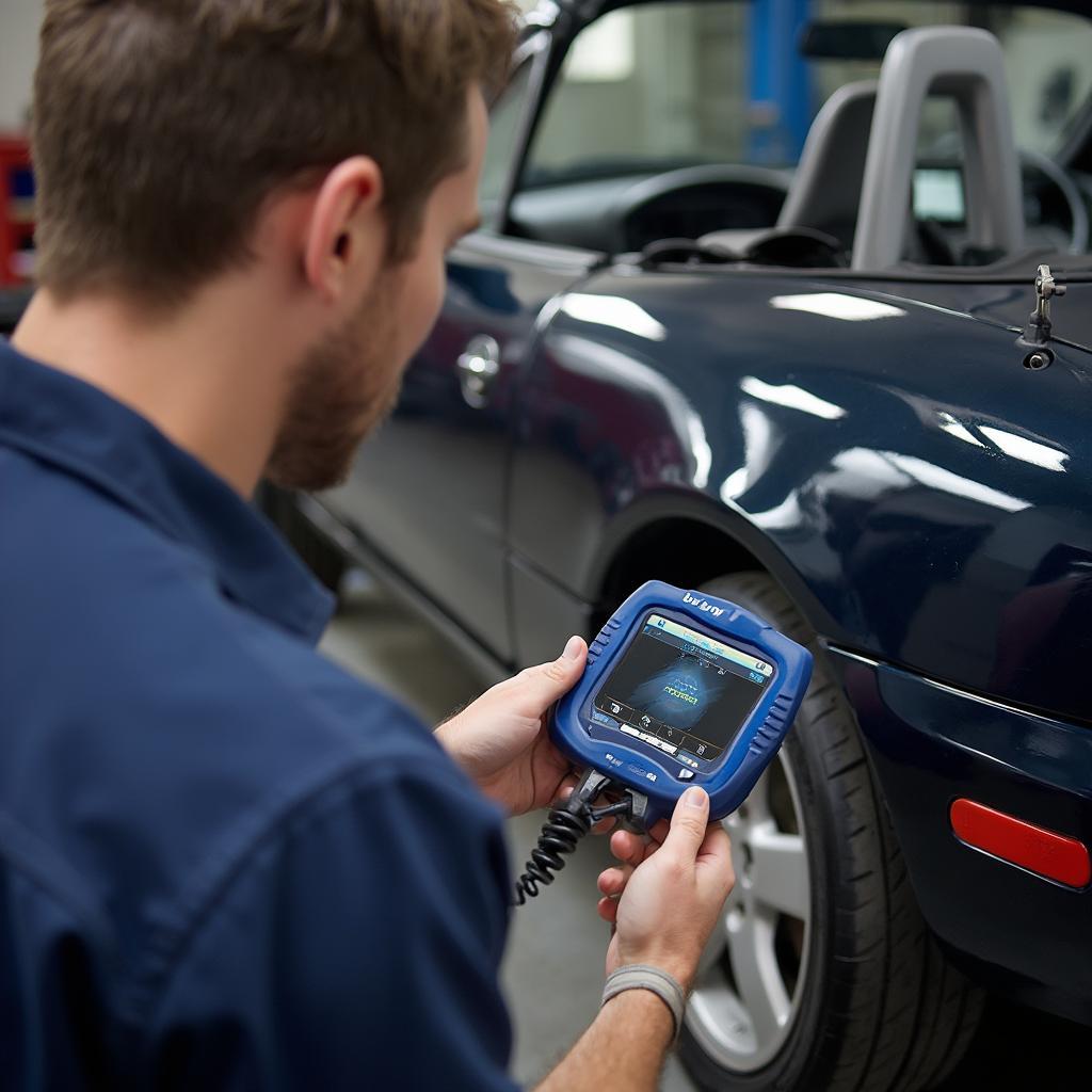 Mechanic diagnosing a 97 Miata using Bluedriver OBD2