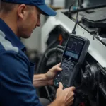 Mechanic Verifying Repair with OBD2 Scanner