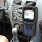 MS309 OBD2 Scanner plugged into a car's OBD2 port, displaying diagnostic trouble codes.