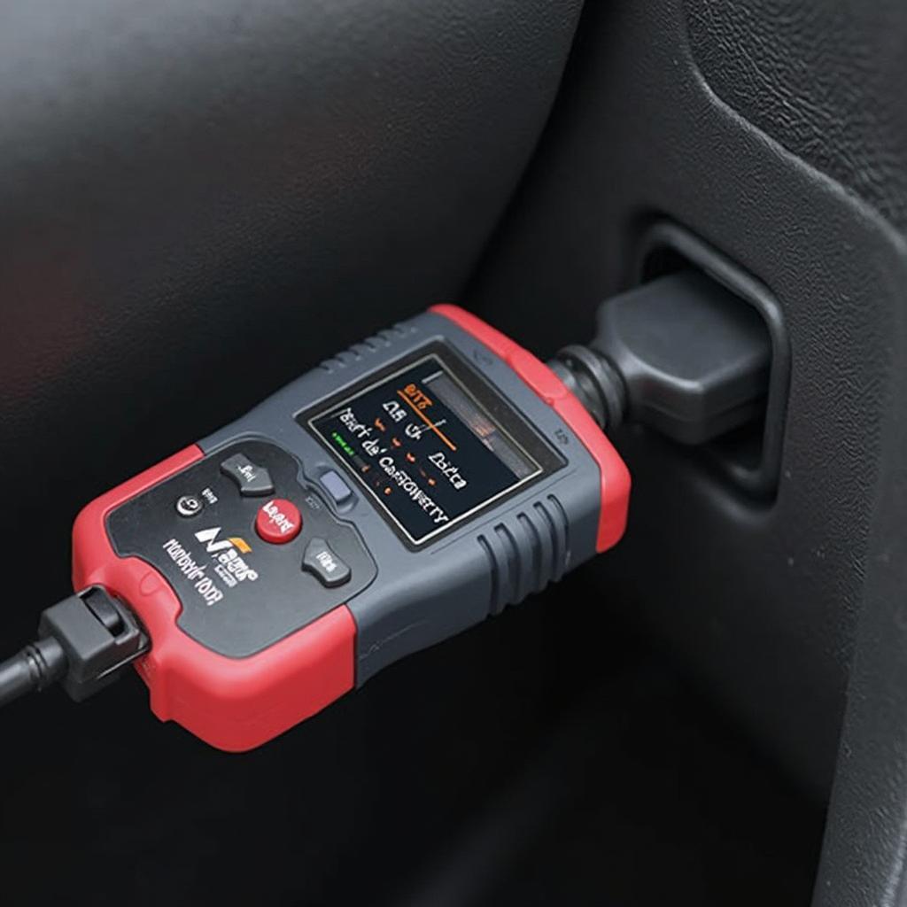 Napa Code Hammer OBD2 Code Reader Plugged into Car's OBD2 Port