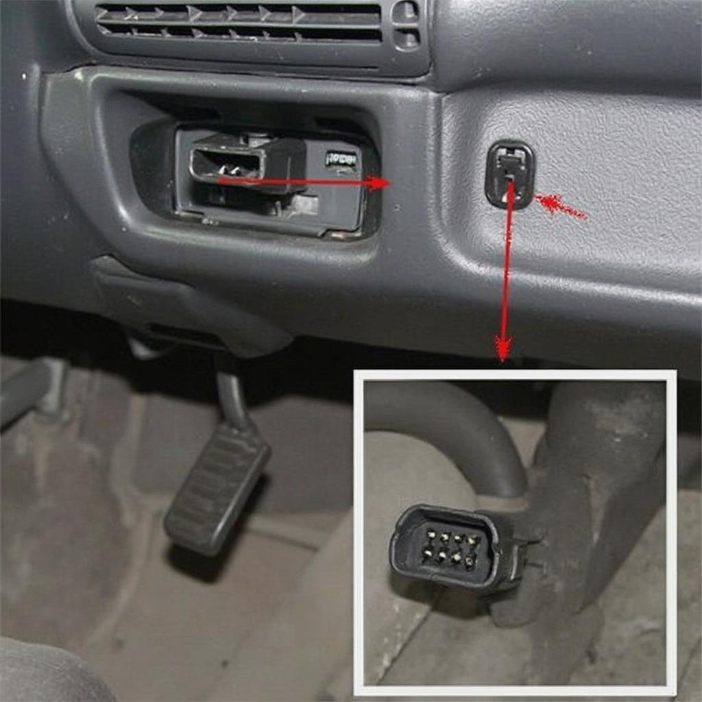 OBD2 6-pin connector location under the dashboard of an older car