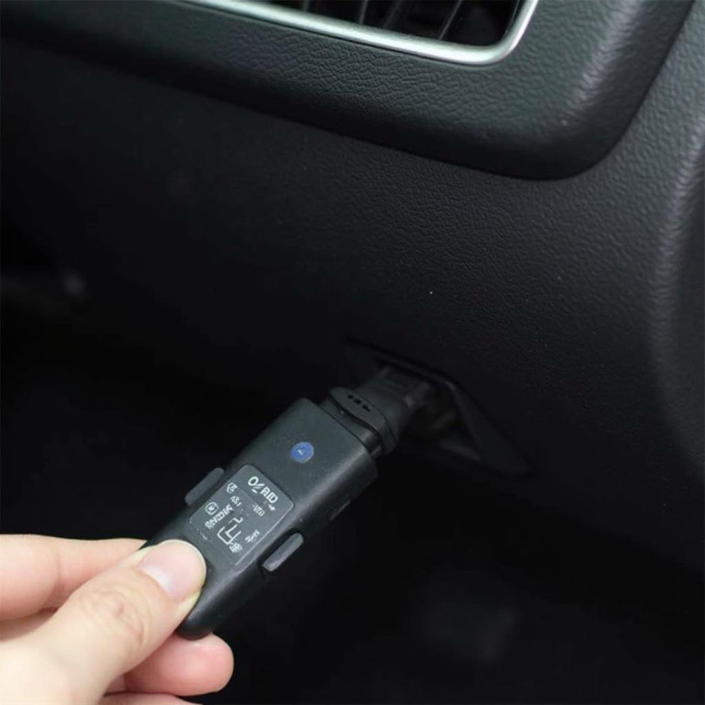 OBD2 Bluetooth Scanner Connected to a Car's OBD2 Port