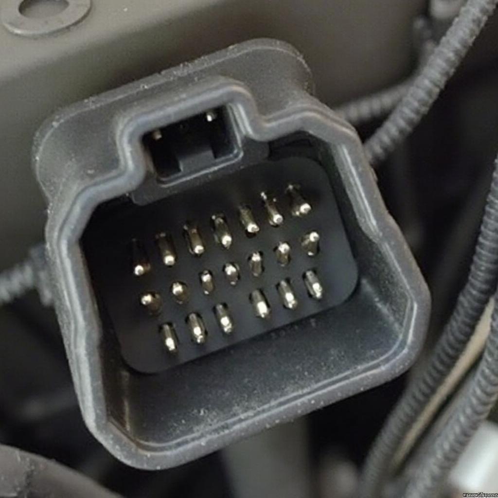 Closeup view of an OBD2 female connector on a car