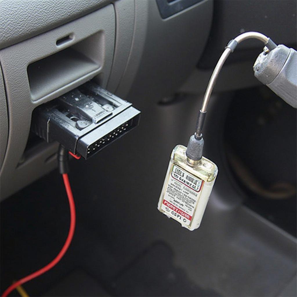 OBD2 Memory Saver Connected to a Car's OBD2 Port