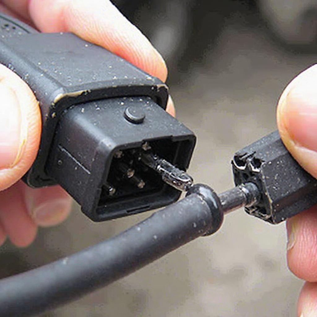 Inspecting-an-OBD2-Wire-for-Damage