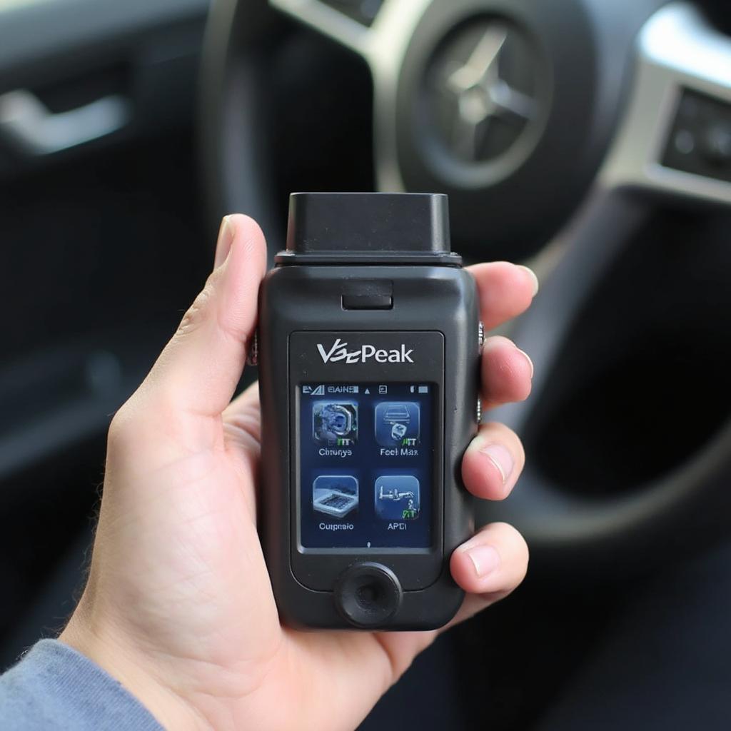 Holding a VeePeak Bluetooth OBD2 Scanner