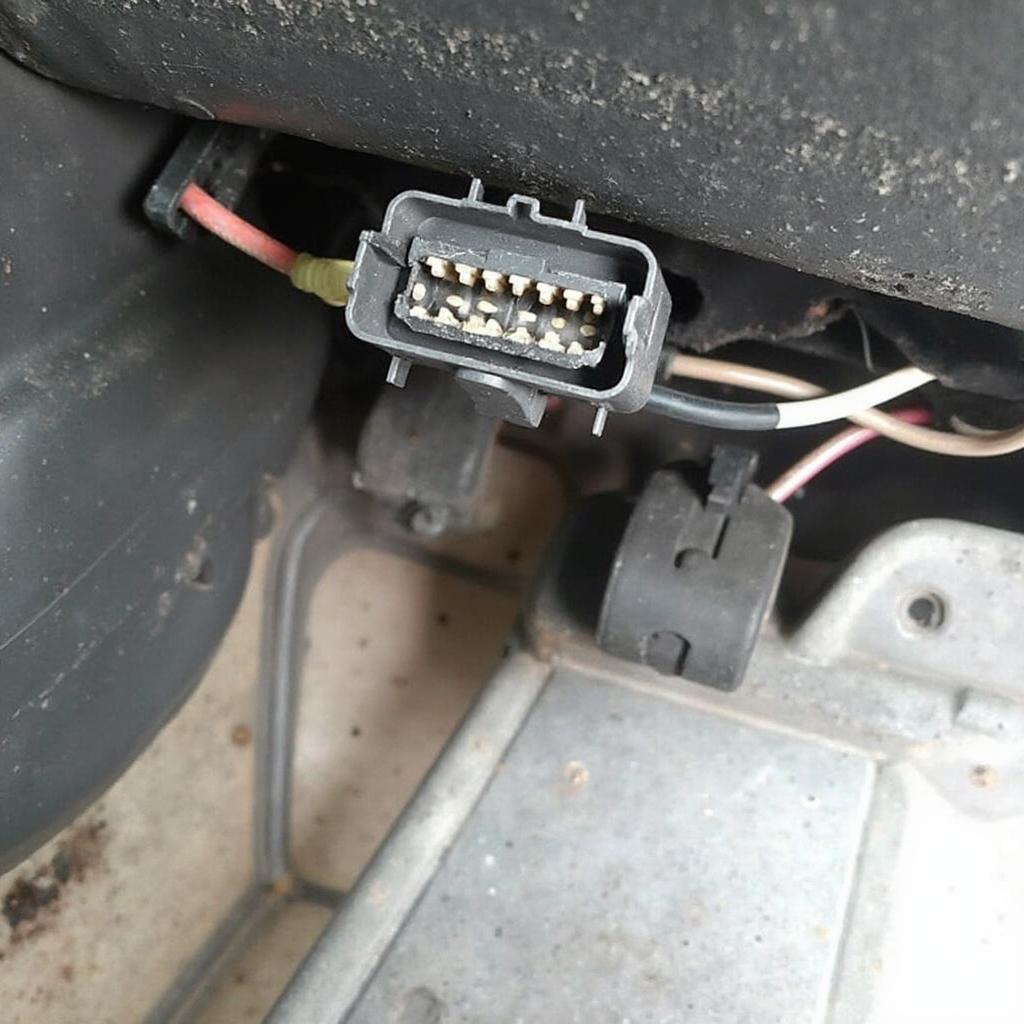 1990 Mitsubishi Eclipse OBD2 port location under the dashboard