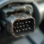 Damaged OBD2 Connector Showing Bent Pins and Corrosion