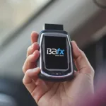 Holding a BAfx OBD2 Scanner