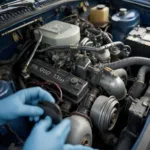 A close-up shot of a car engine being serviced, with a mechanic's hand changing the oil filter.