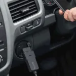 Carista OBD2 Adapter Connected to a Car's OBD2 Port