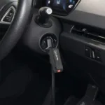 Carista OBD2 device plugged into a car's OBD2 port