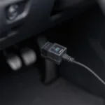 Carly OBD2 adapter connected to a Volkswagen's OBD2 port