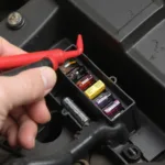 A mechanic checks the OBD2 port fuse.