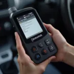 Holding the Innova 3020b OBD2 Scanner