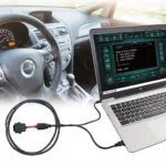 Laptop Connected to Car with OBD2 Cable