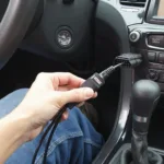 Maxicom OBD2 Cable Connected to Car