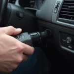 A mechanic connects a professional OBD2 scanner to a car's diagnostic port.