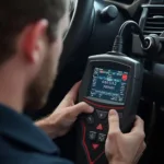 Mechanic Diagnosing P0700 with OBD2 Scanner