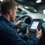 Mechanic Diagnosing a Car with an OBD2 Scanner