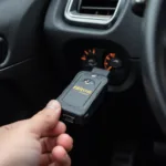 Nitro OBD2 device plugged into a car's OBD2 port