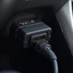 OBD2 Adapter Connected to Car