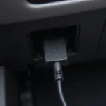 OBD2 Adapter Connected to a Car's OBD2 Port