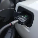 OBD2 Fuel Saver Connected to a Car's Diagnostic Port